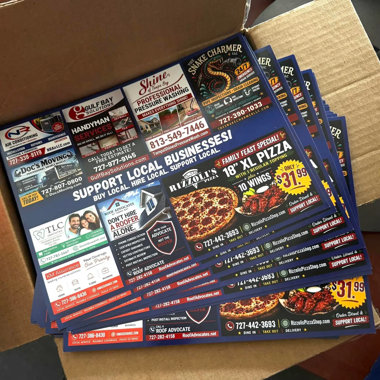 A box of freshly printed Locals Supporting Locals co-op mailers